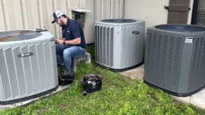 hvac technician repairing an ac unit